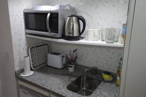 O bucătărie sau chicinetă la Tú Lugar en Buenos Aires