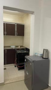 a kitchen with a counter and a stove in it at استراحة المسافر in Al Ain