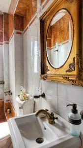 a bathroom with a sink and a mirror at NoVel 1 Luxury apt Katerini in Katerini