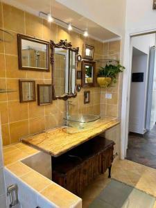 a bathroom with a sink and a mirror at Casa di Lo in Ciampino