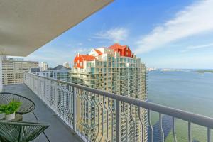 a balcony with a view of the ocean and buildings at Brickell Bay View Oasis with Pool Hot Tub and Gym in Miami