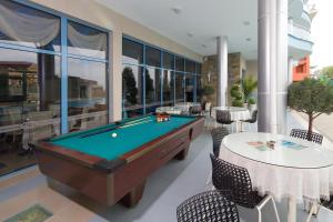 a pool table in the middle of a room at Blue Bay Hotel in Sunny Beach