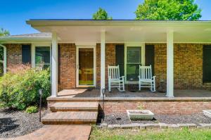 a brick house with two white chairs on a porch at 3BR 2BATH Gorgeous Country Near Nashville F1 in Franklin