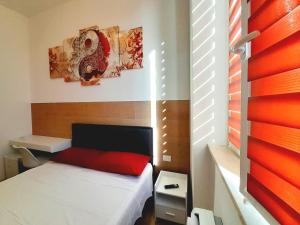 Postel nebo postele na pokoji v ubytování Piazza Teatro Apartments & Rooms + 5 fotografií