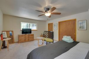 a bedroom with a bed and a ceiling fan at Riverfront Home near Yosemite National Park! in Groveland