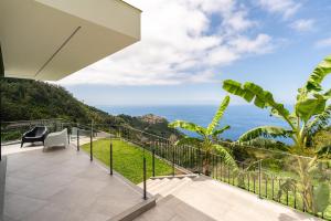 a balcony with a view of the ocean at Villa Rocha in Arco da Calheta in Arco da Calheta