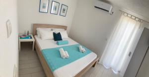 Rúm í herbergi á ORA apartments