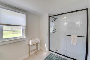 baño con ducha y puerta de cristal en Historic Countryside Escape - Relax, Hike, & Fish!, en Goshen