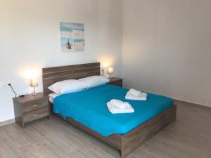 Postel nebo postele na pokoji v ubytování Karpadise Villa