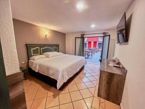 Postel nebo postele na pokoji v ubytování Hotel Casa Real Cholula + 53 fotografií