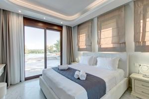 Ένα ή περισσότερα κρεβάτια σε δωμάτιο στο Villa Chrisa