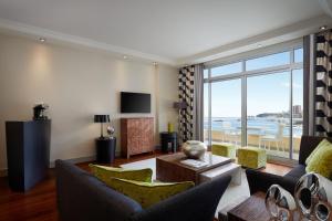 a living room with a view of the ocean at Le Méridien Beach Plaza in Monte Carlo