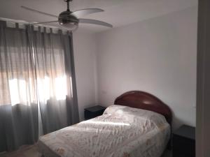 En eller flere senge i et værelse på Apartamentos Playa Holidays