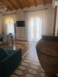 a living room with a couch and a table at Superior Stone in Venetico
