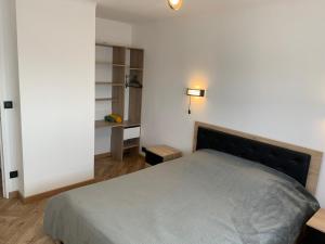 Łóżko lub łóżka w pokoju w obiekcie St Vélodrome 3 chambres parking 8 couchages neuf