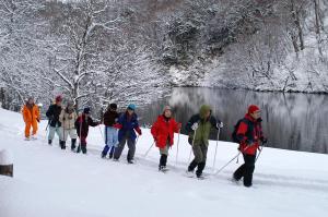 a group of people cross country skiing in the snow at Awone Shirakami Juniko in Fukaura