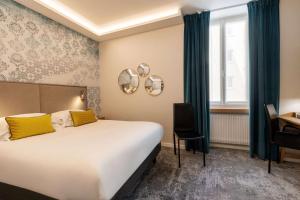 Postel nebo postele na pokoji v ubytování Best Western Plus Monopole Métropole