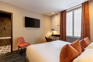 Postel nebo postele na pokoji v ubytování Best Western Plus Monopole Métropole