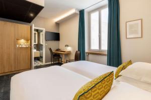 Postel nebo postele na pokoji v ubytování Best Western Plus Monopole Métropole
