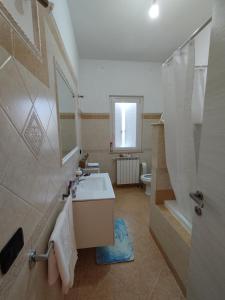 a bathroom with a sink and a shower and a toilet at Casa Circe in San Felice Circeo