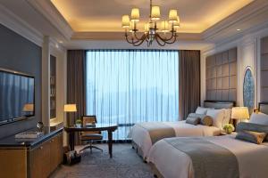 Voodi või voodid majutusasutuse The Ritz-Carlton, Macau toas