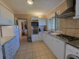 A kitchen or kitchenette at Villa Aurica