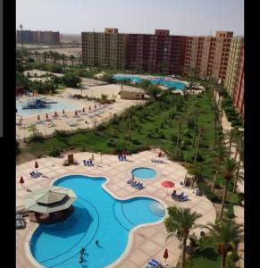 an aerial view of a pool at a resort at Porto Golf Marina - Golf Bay in El Alamein