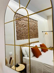 En eller flere senge i et værelse på Galatola Suite