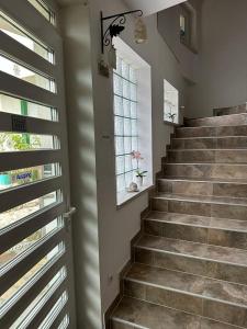 a staircase in a home with a window at Residence Mahala in Sarajevo