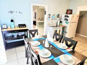 a kitchen and dining room with a table and chairs at CasaAzul-2605B-Beach & Pleasure Pier a block away in Galveston