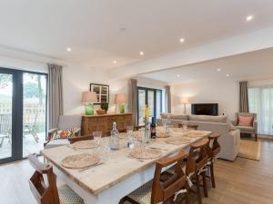 a large dining room with a table and chairs at The Stables in Cheriton