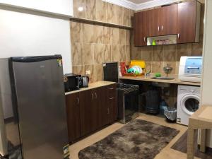 A kitchen or kitchenette at Amazing Chalet at Bluebay Asian Resort Pool View - Families Only