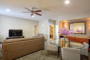 a living room with a couch and a table at Courtyard by Marriott McAllen in McAllen