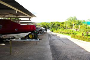 a row of boats parked outside of a building at Apartamento Enseada Náutico Caldas Novas - GO in Caldas Novas