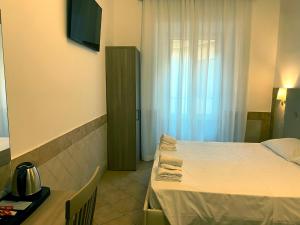 Postel nebo postele na pokoji v ubytování Hotel Alex Square
