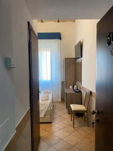 Postel nebo postele na pokoji v ubytování Hotel Alex Square