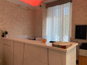 TV a/nebo společenská místnost v ubytování Hotel Alex Square
