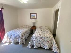 Postel nebo postele na pokoji v ubytování Greybull Motel