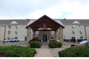 a building with an american flag in front of it at GreenTree Suites Eagle / Vail Valley in Eagle