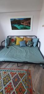 a bed with pillows on it in a room at Casa Domingos Cales De Mallorca in Calas de Mallorca