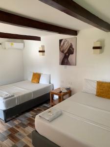 Postel nebo postele na pokoji v ubytování Hotel Agroturistico Palma Vino