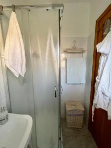 a bathroom with a shower and a sink at Casa Frontemare in Carloforte