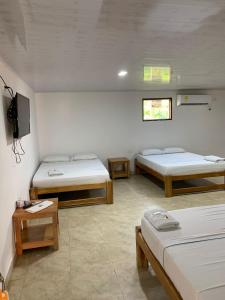 Postel nebo postele na pokoji v ubytování Hotel Agroturistico Palma Vino