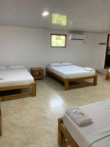 Postel nebo postele na pokoji v ubytování Hotel Agroturistico Palma Vino