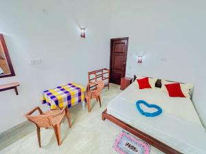 Una cama o camas en una habitación de Sayuru Villa