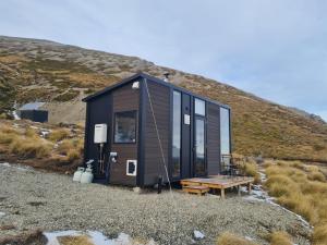 a tiny house sitting on top of a hill at Lake Stella 3 - Hawke Eye in Mt Lyford