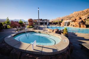 a swimming pool in the middle of a resort at Sage Creek at Moab Luxury Two Unit A in Moab