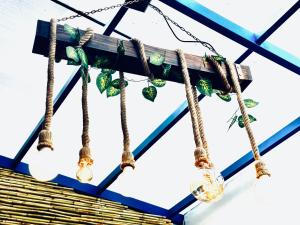 a group of light bulbs hanging from a roof at AITANA'S HOUSE - SAN BLAs in Cusco