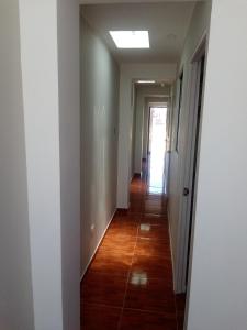 a hallway leading to a room with a hallway at Hospedaje Vivanco 