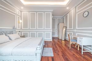 Postel nebo postele na pokoji v ubytování Desa Residence